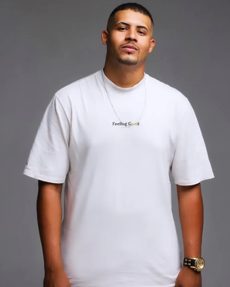 Leonardo Sena, founder of SENA Creative Studio, in a studio portrait wearing a white T-shirt.